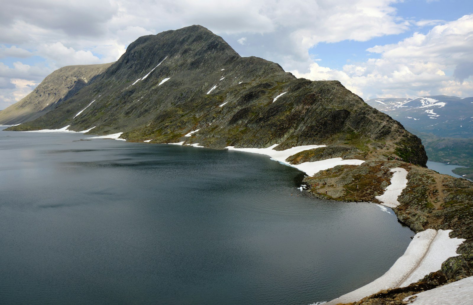 The Besseggen ridge rising above a mountain lake in Jotunheimen, Norway.