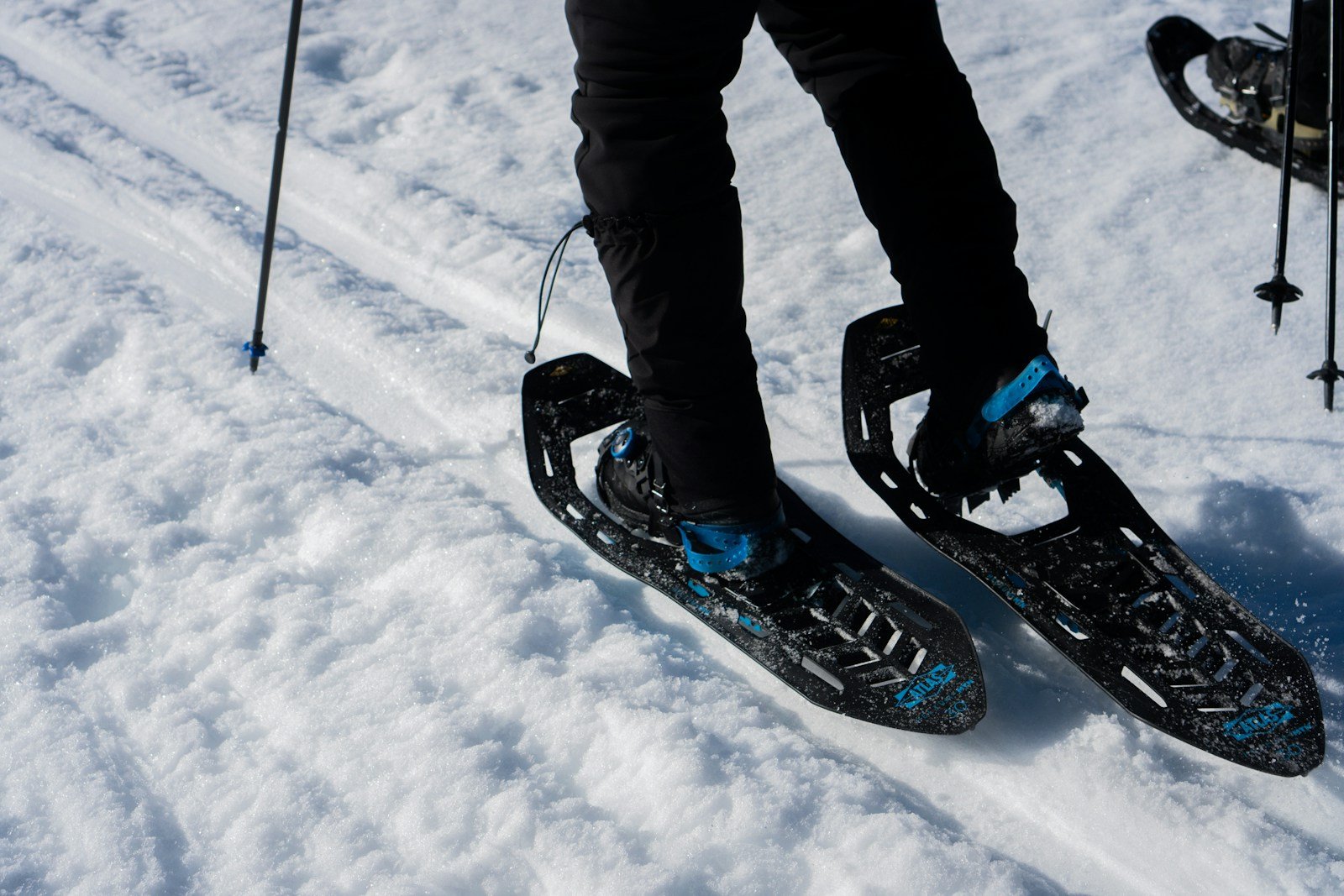 A person riding skis down a snow covered slope