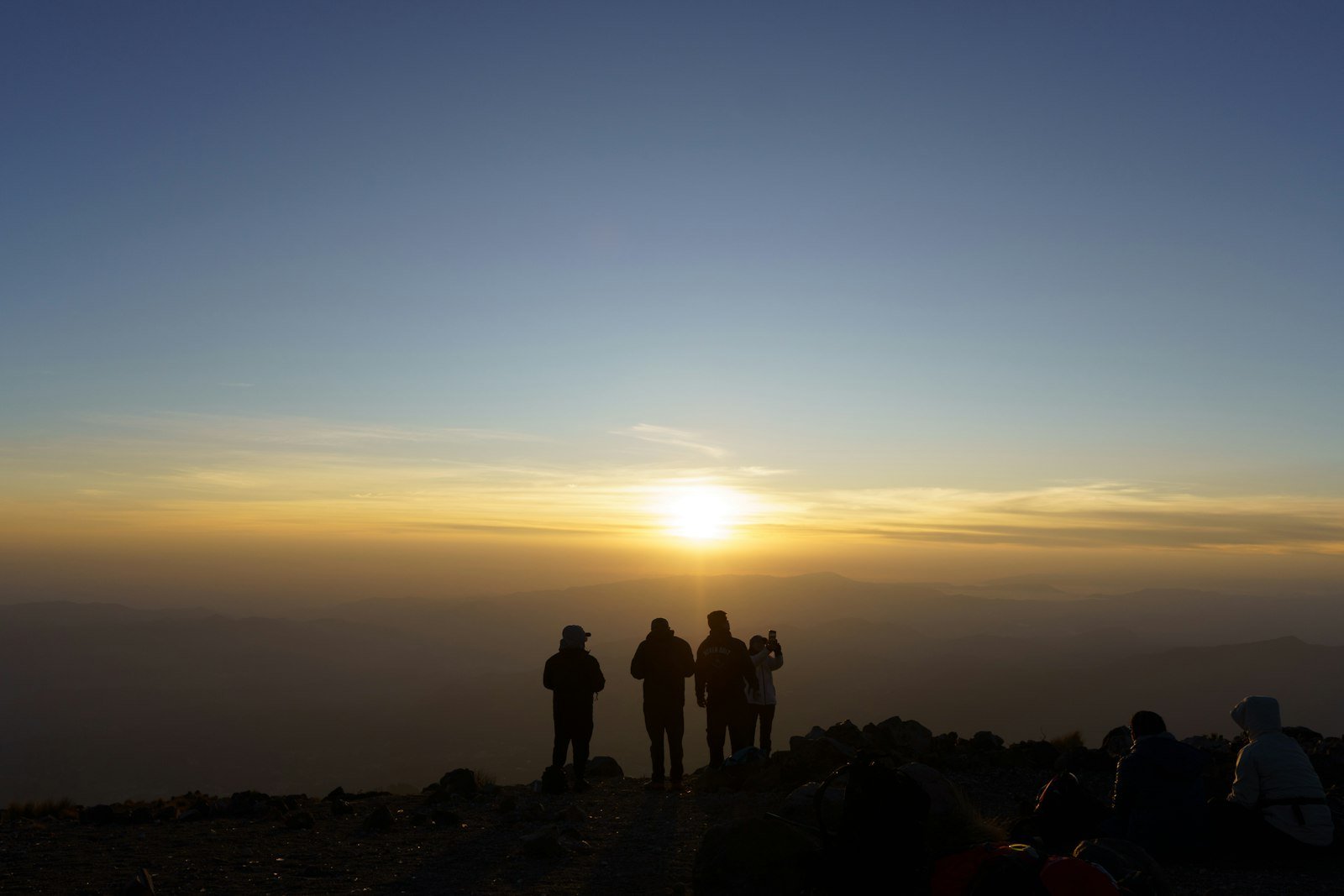 Climbers on Kilimanjaro at sunrise.